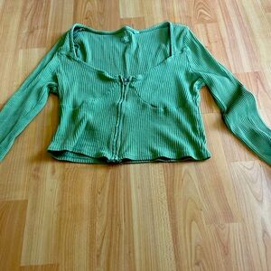Green long sleeve top with zipper up the front